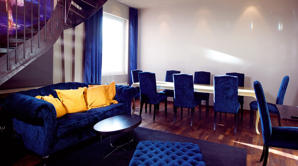 Suite with living room and large dining room at Folketeateret Hotel in Oslo