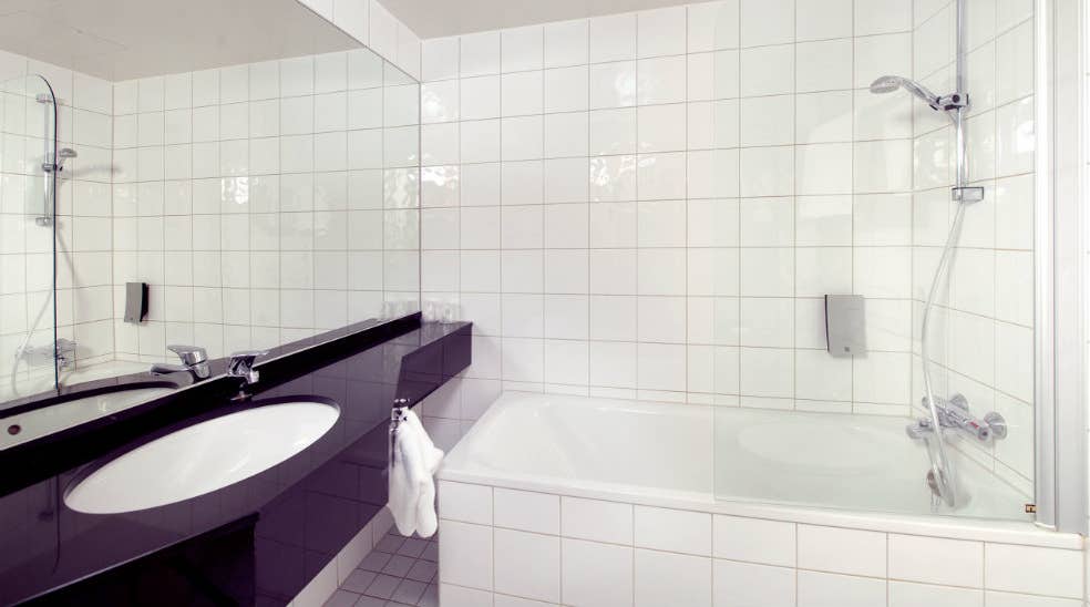 Superior double room with large bathroom and bathtub at Aurora Hotel in Tromso
