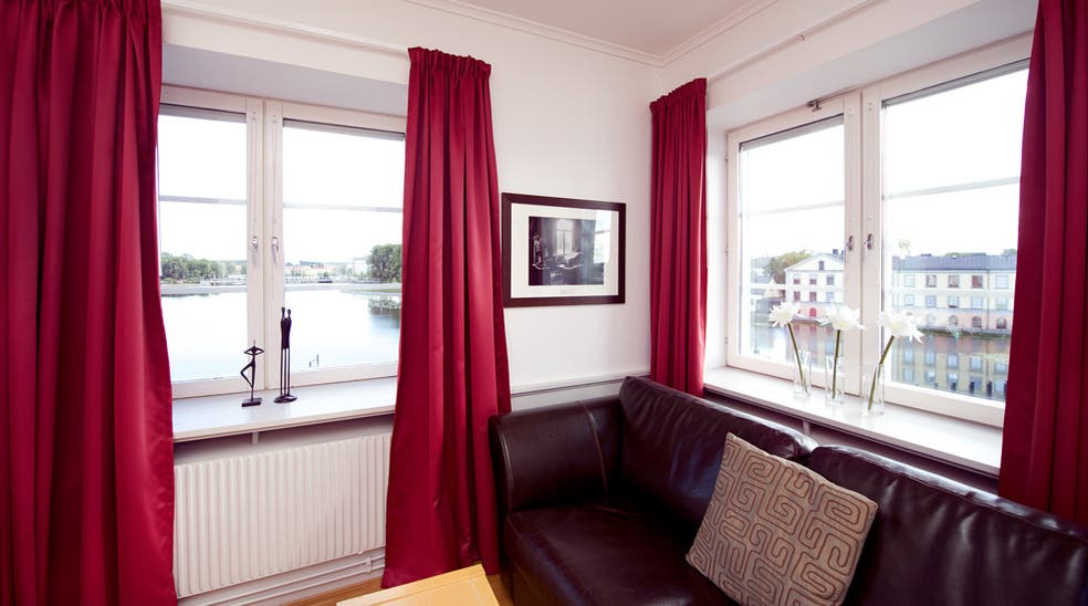 Bright family room with lake view at Bolinder Munktell Hotel in Eskilstuna