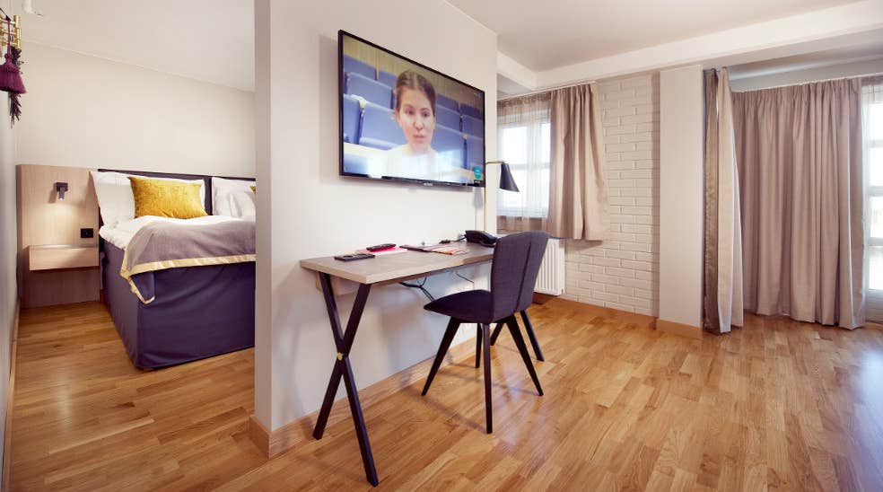 Work place and TV in Deluxe room at Clarion Collection Hotel Bryggeparken