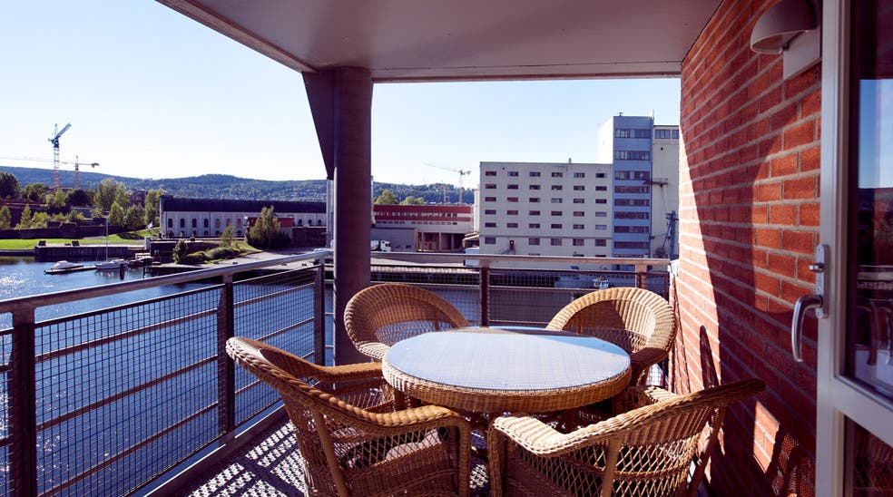 Outside area including a balcony with amazing view of he canal at Bryggeparken Hotel in Skien