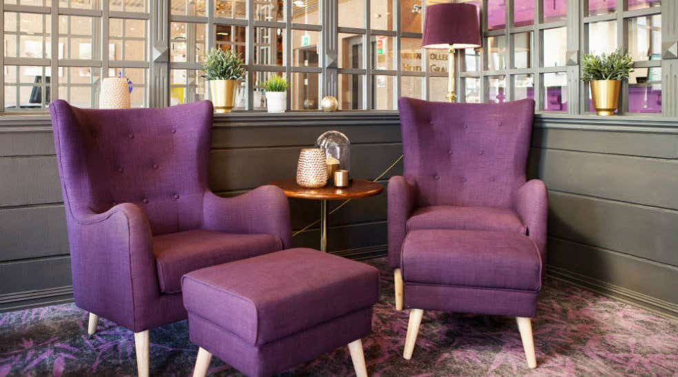 Purple chairs in the lobby of Clarion Collection Hotel Grand Gjøvik in Norway