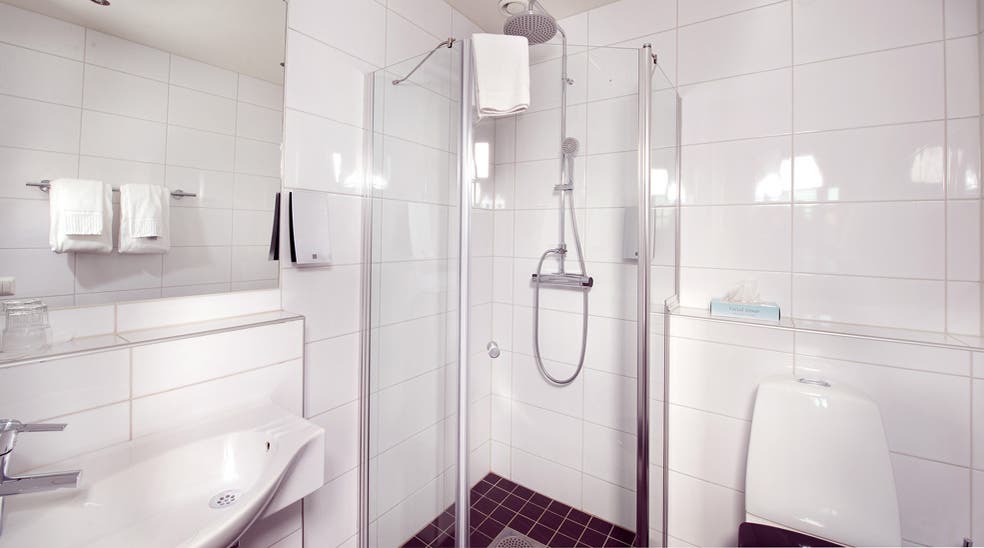 Large and modern bathroom in superior double room at Majoren Hotel in Skovde