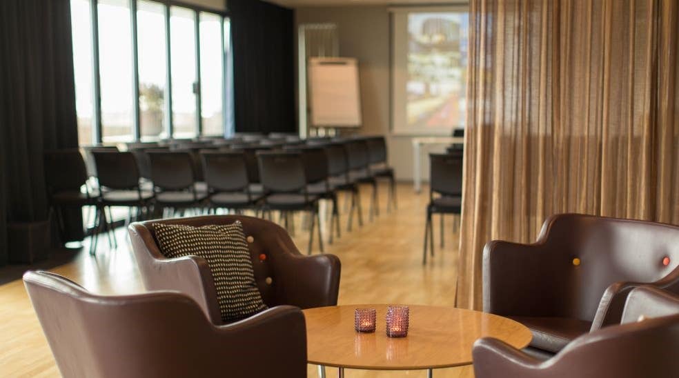 Leather chairs in meeting room with terrace at Clarion Collection Hotel Odin in Gothenburg