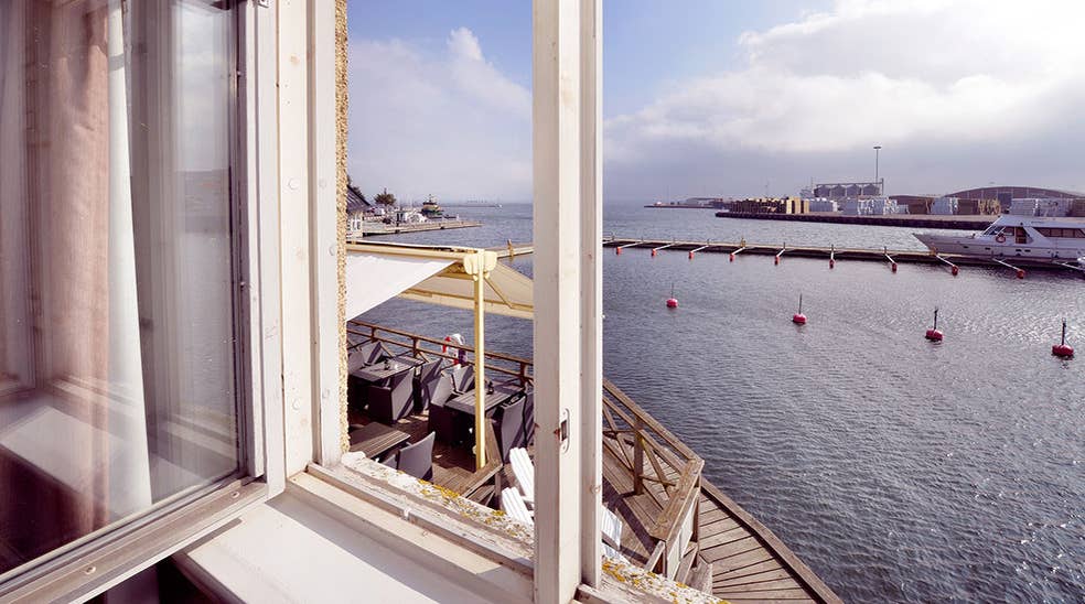 Hotel room with a great view of Kalmar harbour and the ocean at Packhuset Hotel in Kalmar