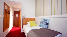 Minimalist single hotel room at Post Hotel in Oskarshamn
