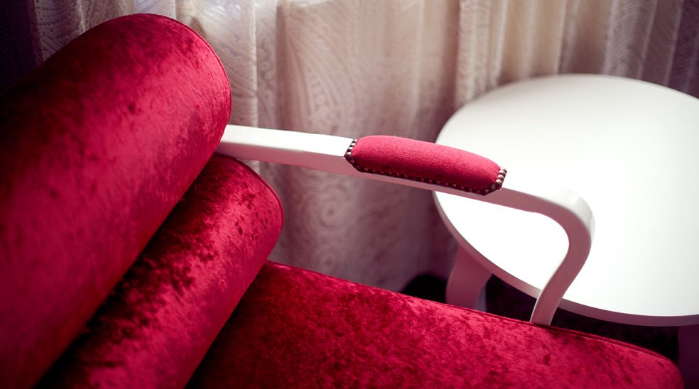 Interior design including a colourful designer chair at Savoy Hotel in Oslo