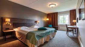 Overview Standard double room with double bed and desk at Clarion Collection Hotel Uman Umeå
