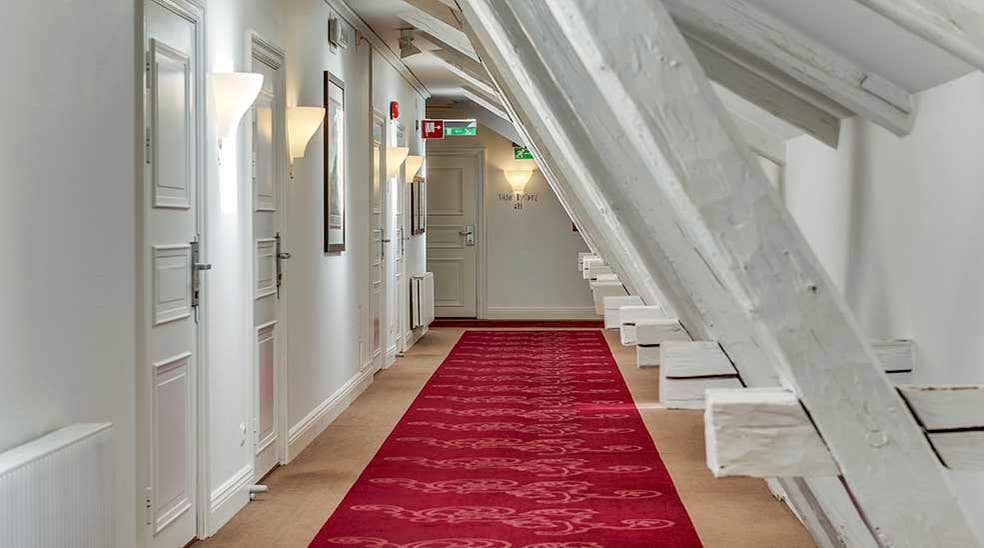 Hallway with a red carpet at Clarion Collection Hotel Victoria Jönköping