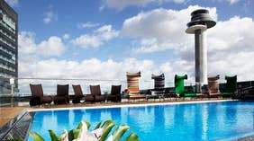 Large pool and spacious outside pool area at Arlanda Hotel in Stockholm