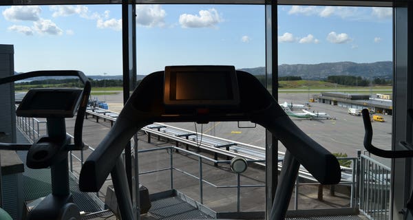 Modern gym with a great view of Bergen airport at Bergen Airport Hotel in Bergen