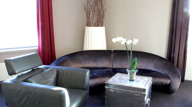 Stylish and comfortable living room in the junior suite at Bergen Airport Hotel in Bergen