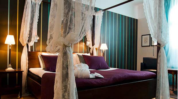 Colourful and elegant deluxe hotel room at Hotel Orebro