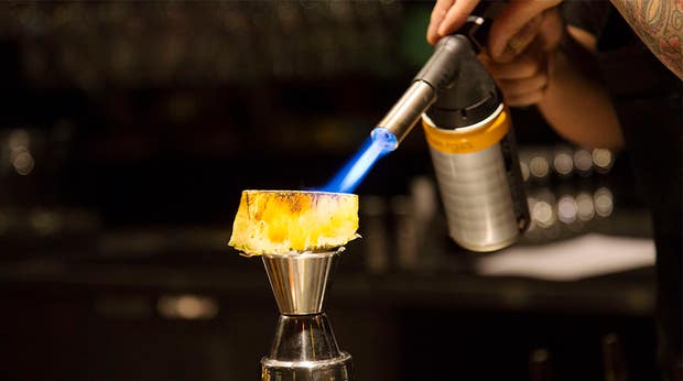Close-up image of a pineapple being flambéed at the Vatos bar at the Clarion Hotel Stockholm
