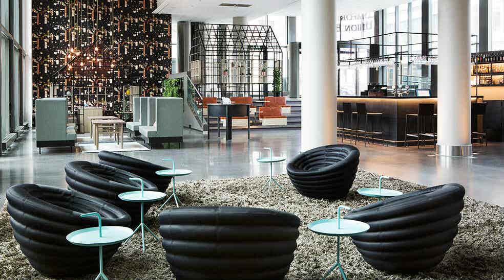 Lobby with lounge area and black chairs at Comfort Hotel Union Brygge in Drammen Norway