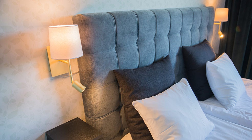 Bed post and lamp in a Superior double room at Quality Hotel Galaxen in Borlänge