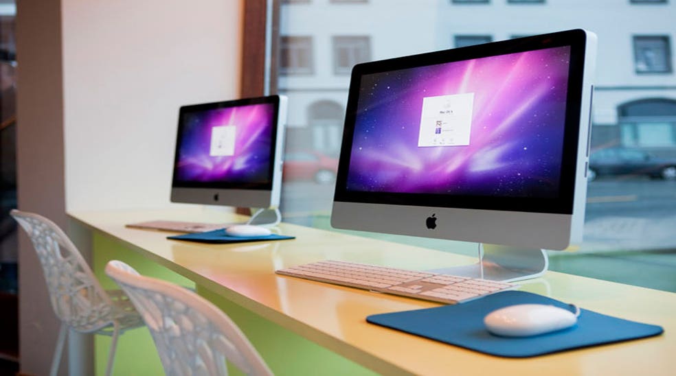Modern hotel pc facilities including several iMacs at Quality Waterfront Hotel in Alesund