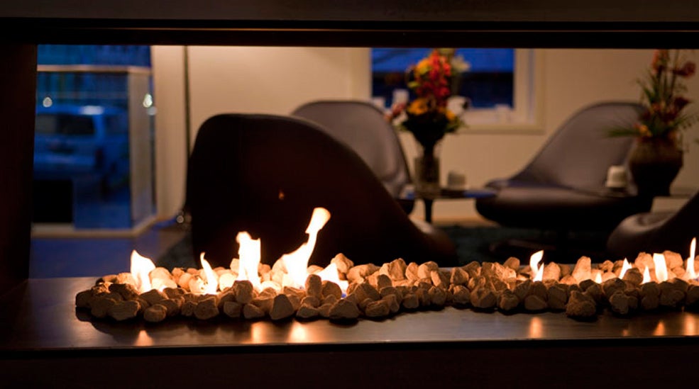 Tranquil lounge with an open fireplace at Quality Waterfront Hotel in Alesund